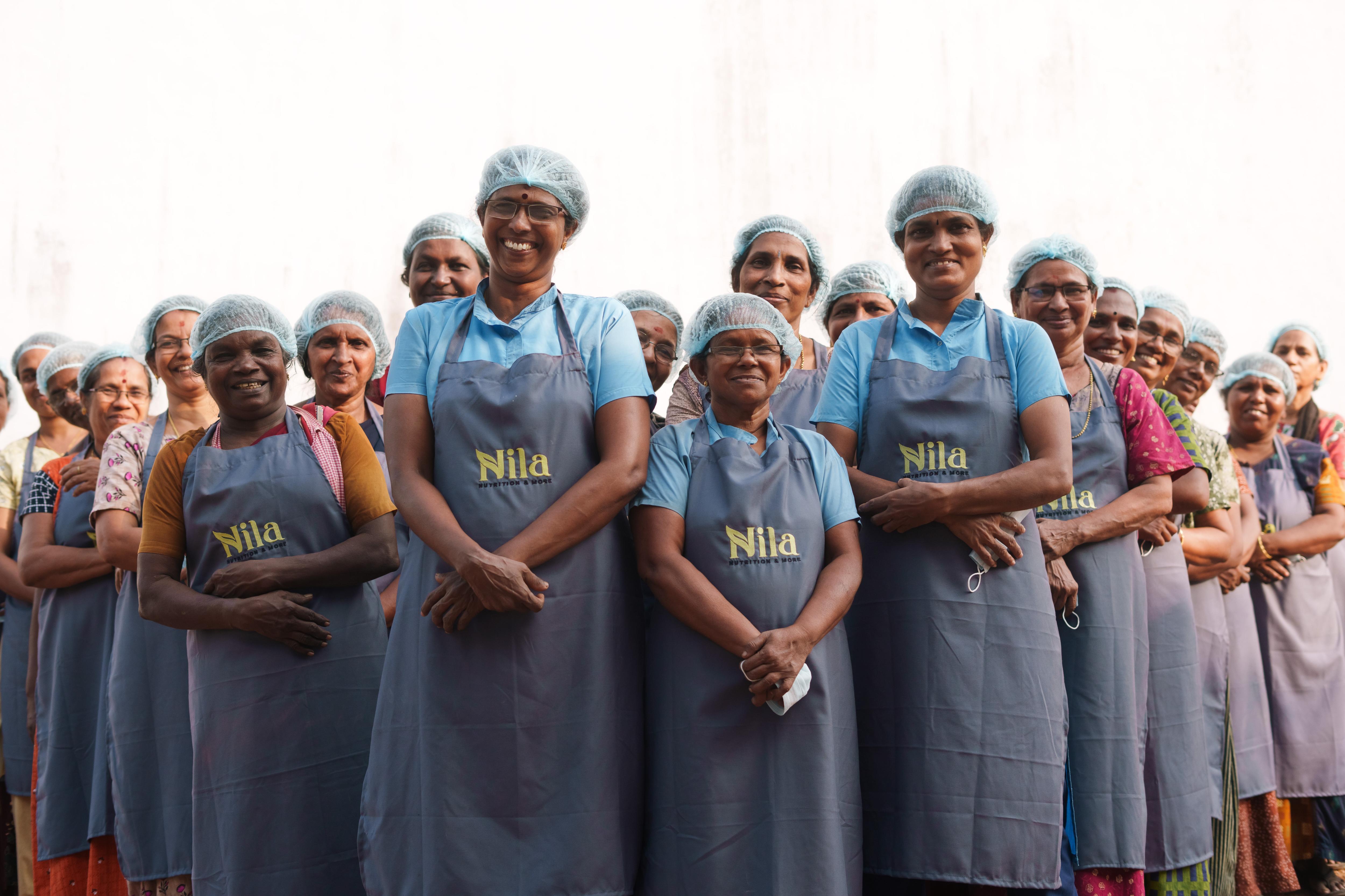 Empowered women laborers working in a cashew factory, processing and sorting premium quality cashew nuts with expertise and dedication